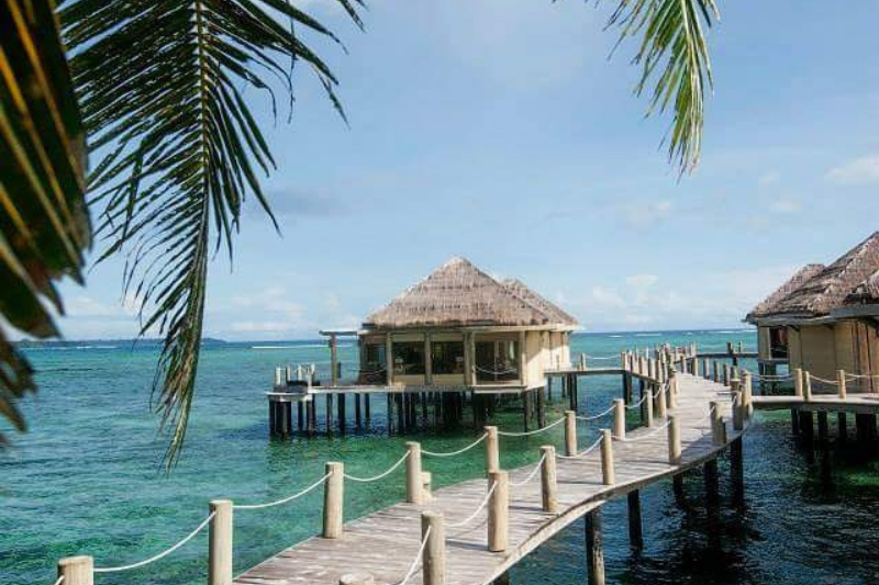 Overwater bungalow at Coconut Beach Resort and Spa. 