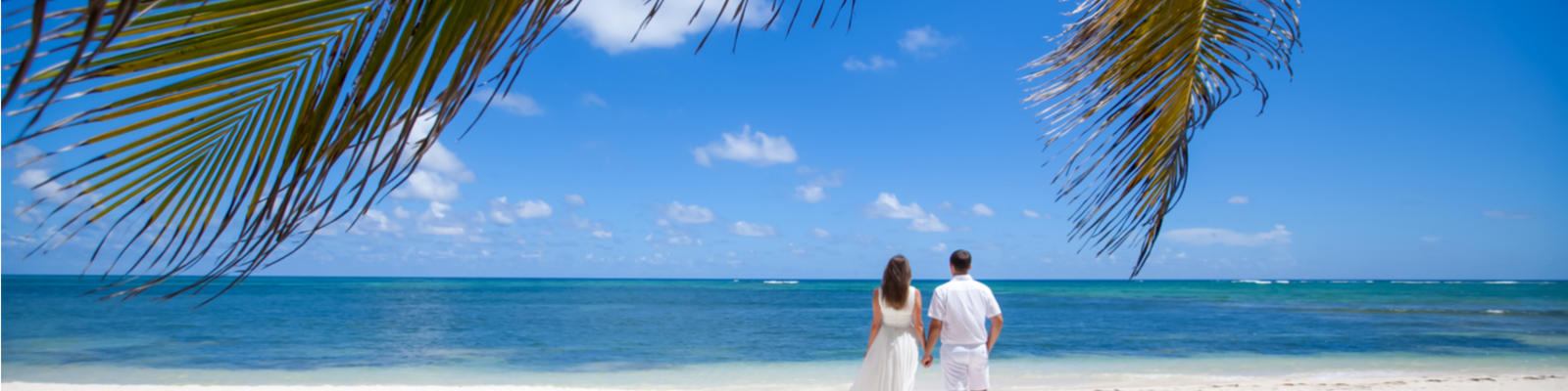 Wedding couple on beautiful white sand beach (Shuttterstock)